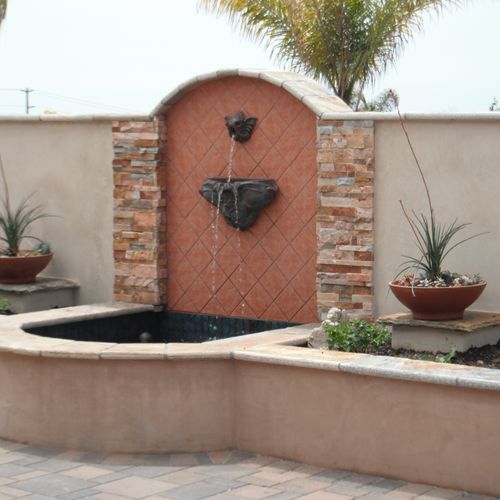 Formal water feature with Copper Carp spitter.