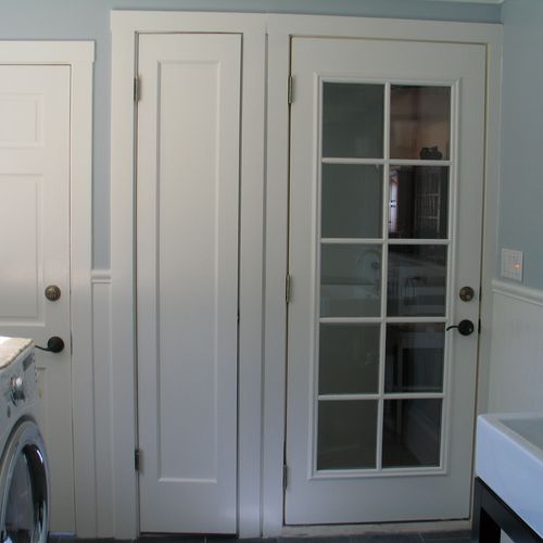 Custom built linen closet. Door without knob.
