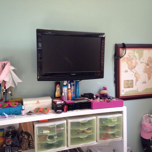 My daughter's custom built shelves with wall-mount