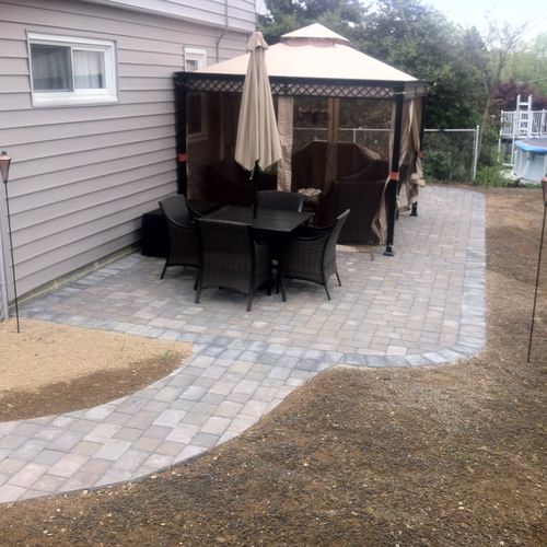 We installed patio and walkway, graded and planted