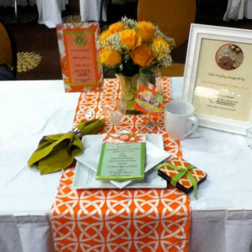 Sample guest table design, orange, lime green & wh