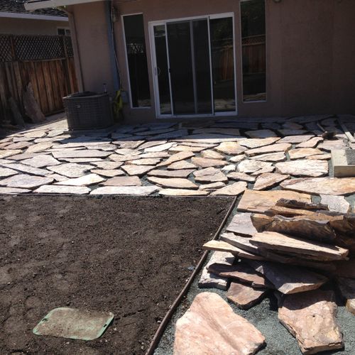 Back yard flagstone patio installation.
