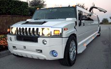 White Hummer limo capable of holding up to 20 pass
