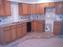 Cabinets stained and installed in home renovation