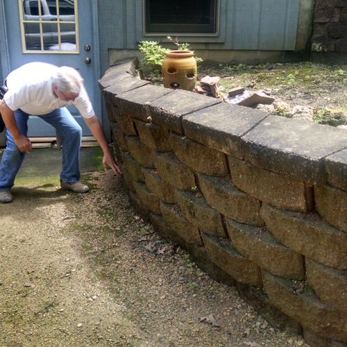 Noting that the retaining wall needs attention