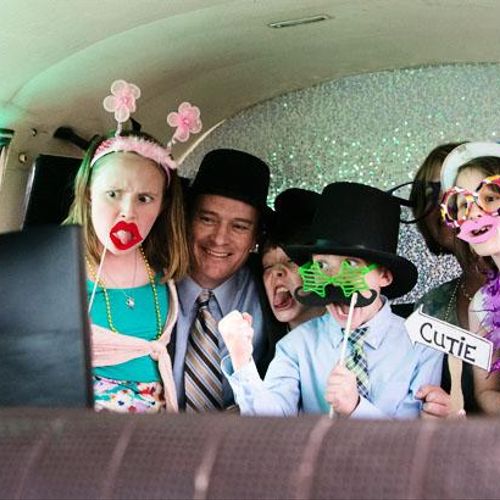 Guests enjoying our VW bus photo booth at a weddin