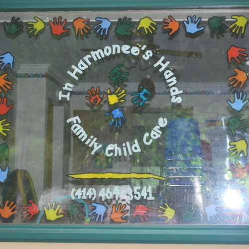 In Harmonee's Hands Daycare window signage.