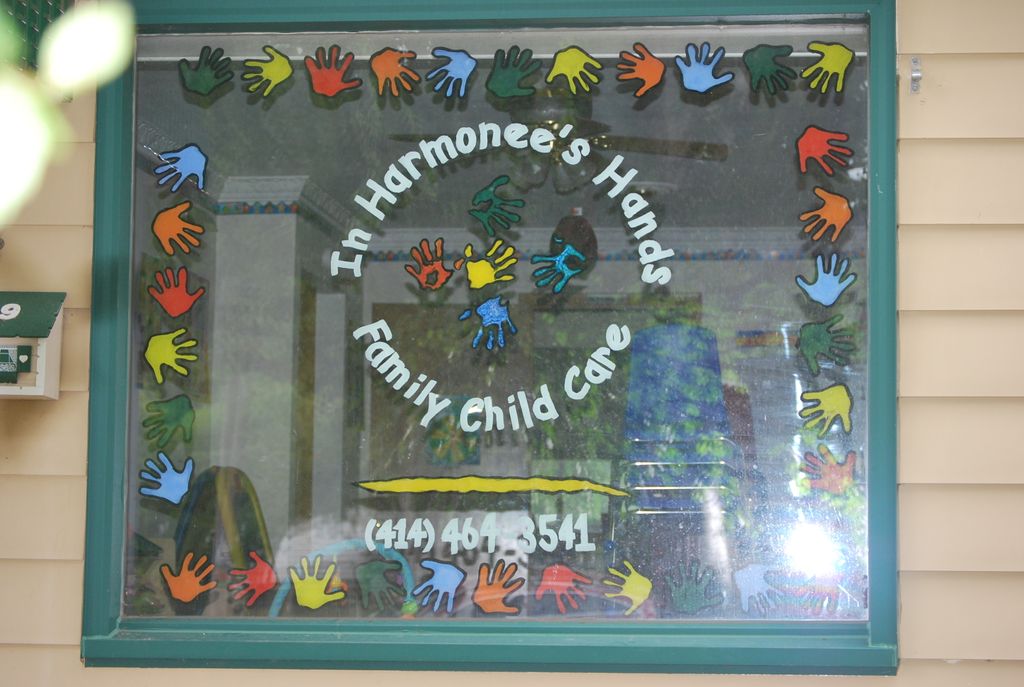 In Harmonee's Hands Daycare window signage.