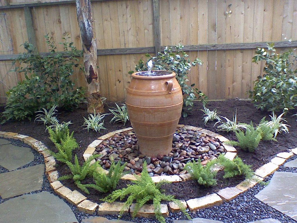 A nice fountain with stone and perennials. Pic 3