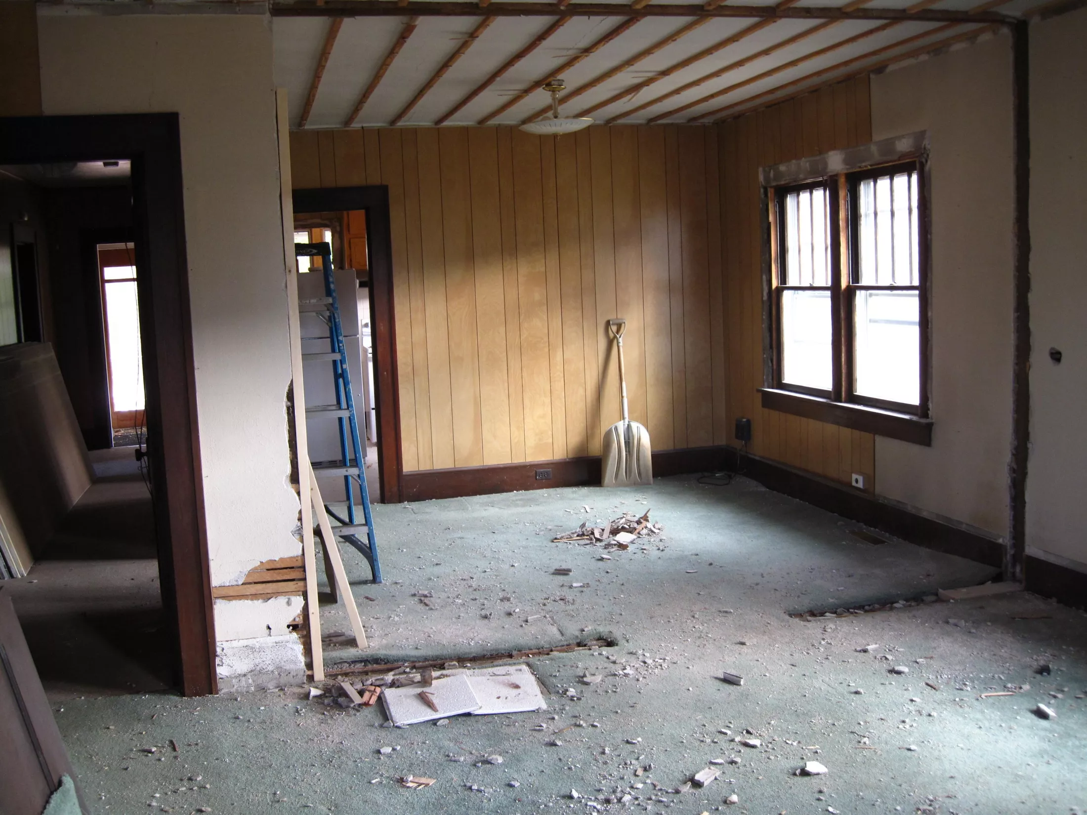 room under construction with step ladder and shovel