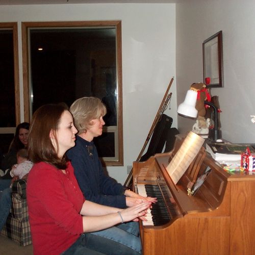 Playing a duet with my piano teacher, 2006