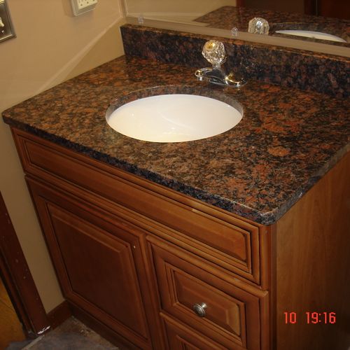 new granite sink and vanity  in a recent bath remo