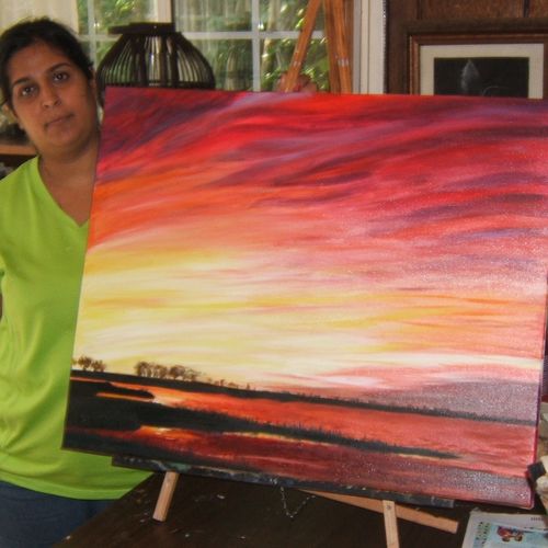 An adult student and her recent painting.