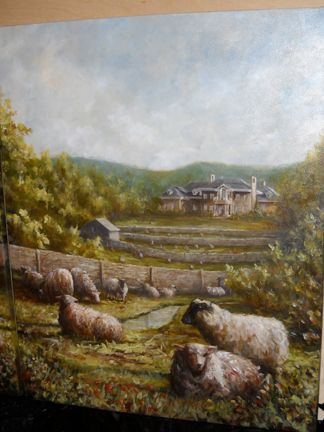 A painting of sheep in pasture with the client's h