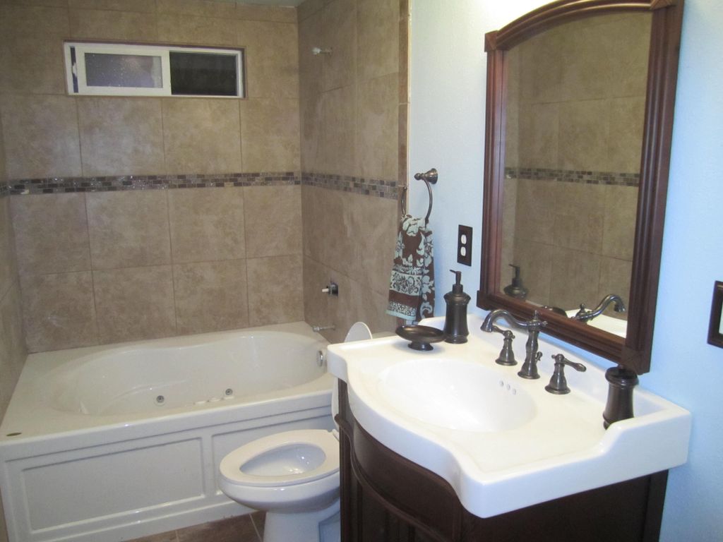 Full bathroom make over, new 42" tub, tile, toilet