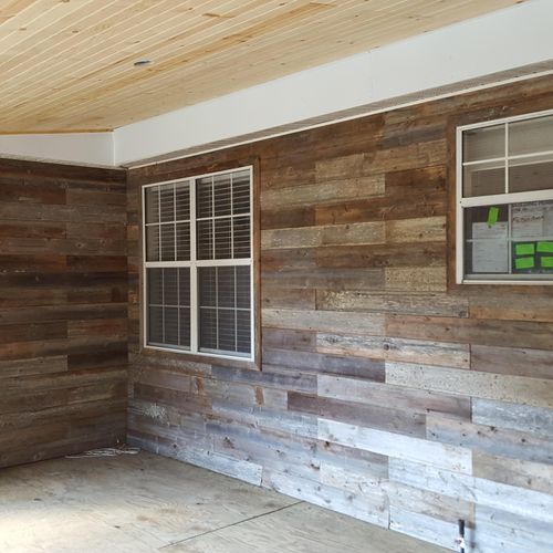 wall covered with reclaimed cedar fence boards 
