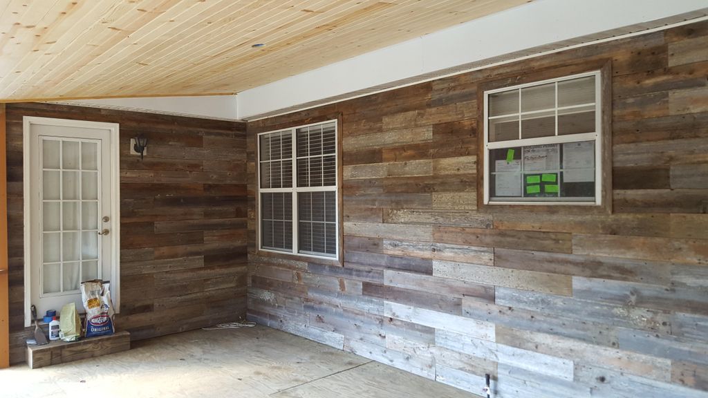 wall covered with reclaimed cedar fence boards 