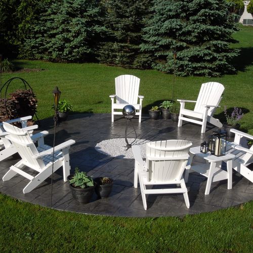 Decorative stamped circular concrete patio with a 
