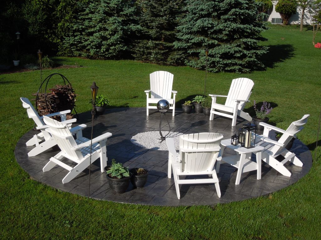 Decorative stamped circular concrete patio with a 
