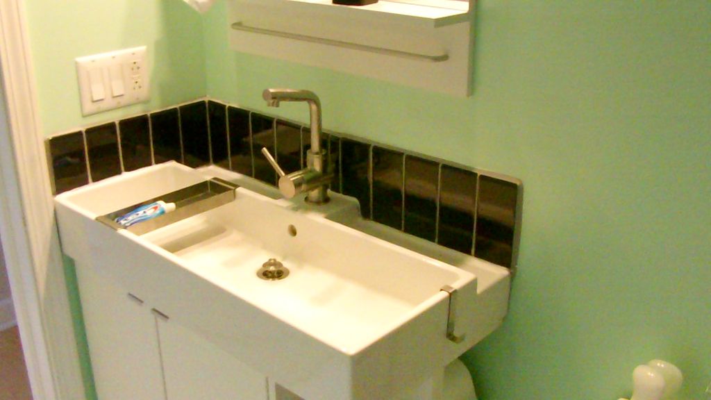 Chicago - Ikea sink, high gloss black subway tile,