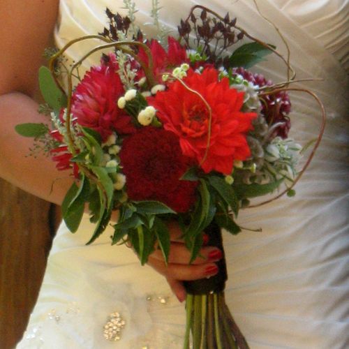 Bridal bouquet featuring mixed dahlias and a varie