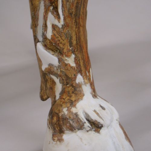 Loss compensation in the foot of a gilded 18th C. 