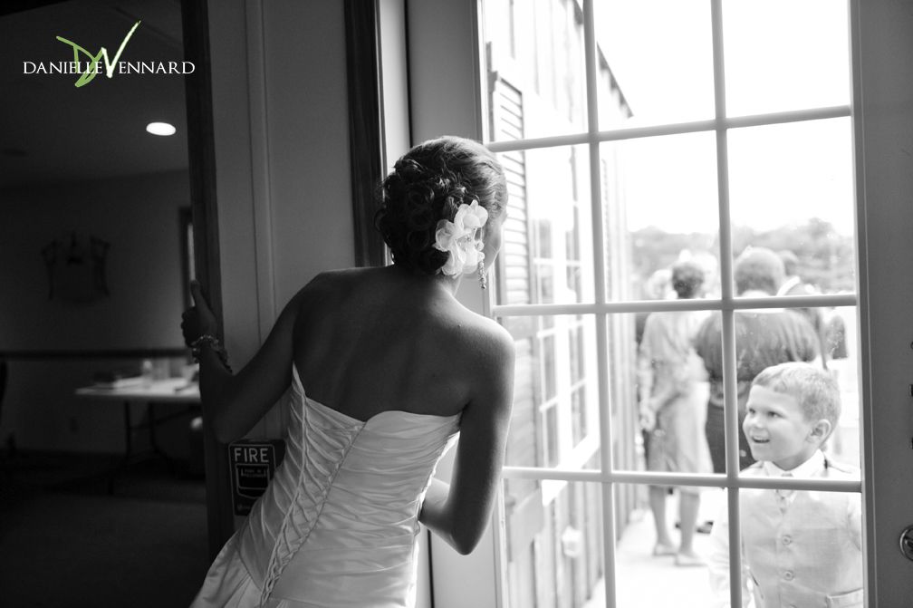 Bride trying to steal a glimpse of her Groom right