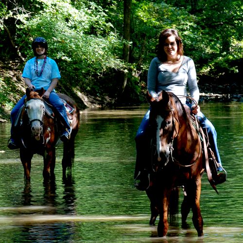 Trail Riders on a Ride thru the Creek.