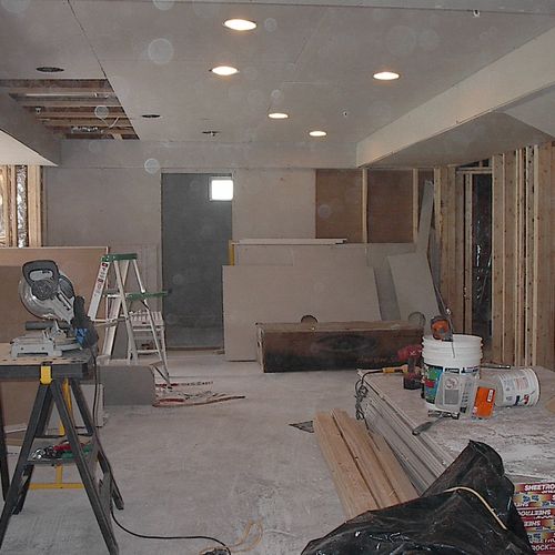 Drywall installation of unfinished basement.
Bethe
