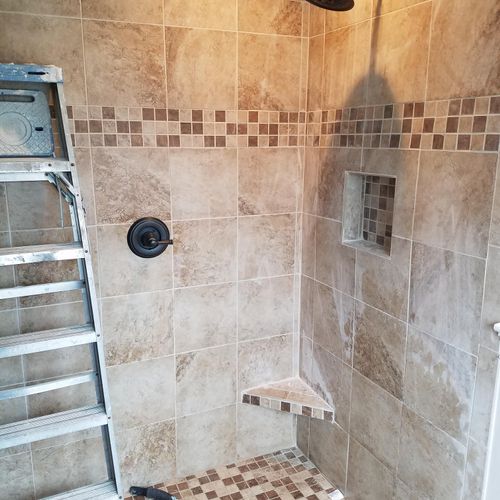 installation of new shower trim after the tile wor