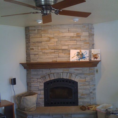 New fireplace with stacked stone.