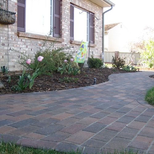 This paver walkway adds character to the front of 