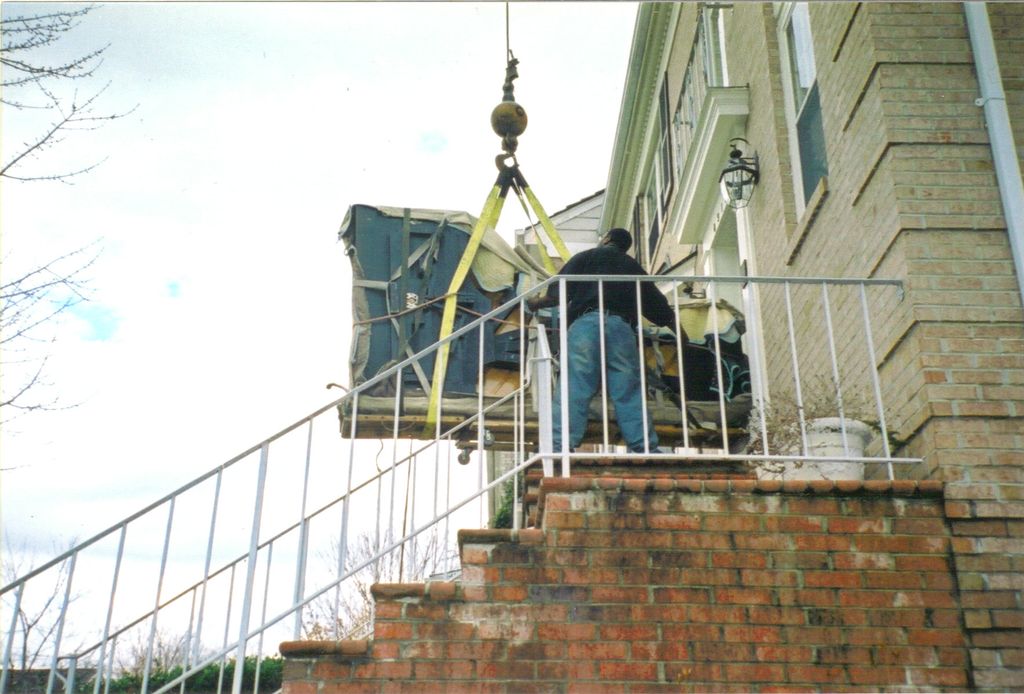 Getting ready to lift the piano.