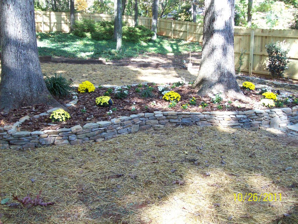 Freshen up lawn, add stone wall accents, add stone