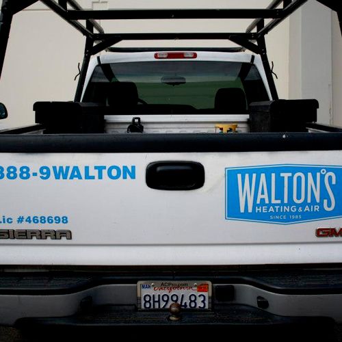 Walton's Heating and Air company trucks