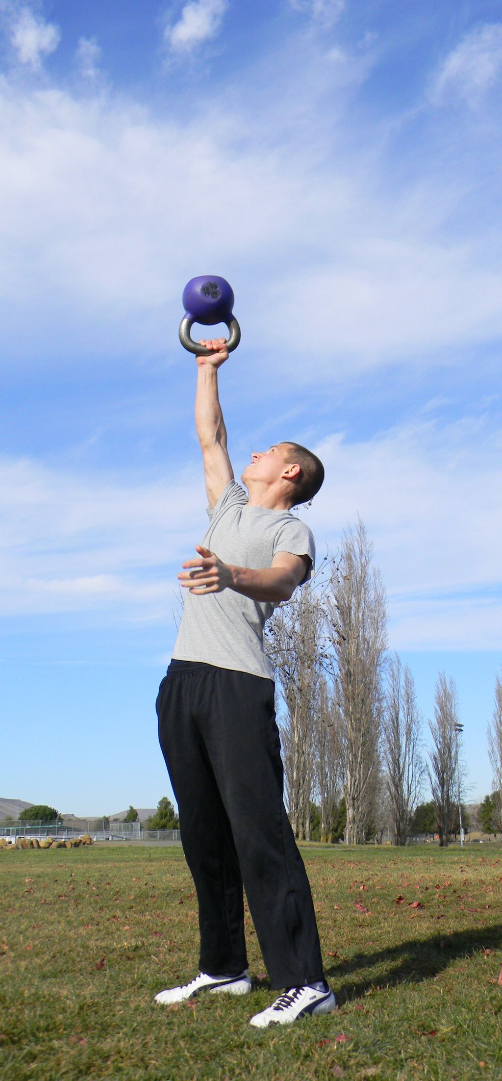 Jeff doing a bottoms up press with 20 kg kettlebel