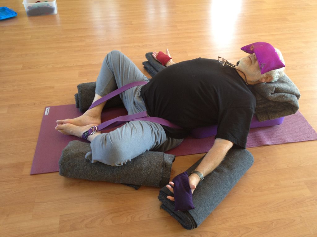 Restorative pose Supta Baddha Konasana makes space