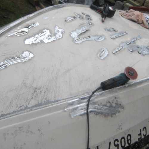 An aluminum boat that had deep scratches and punct