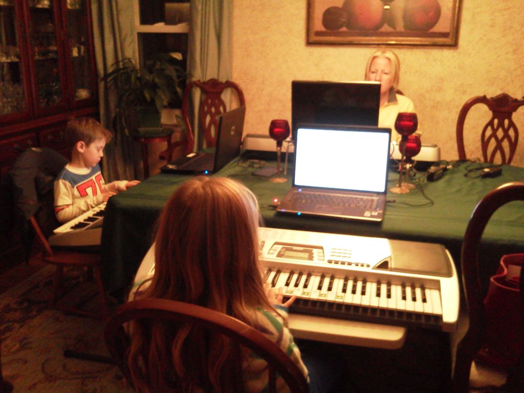 Mother, daughter and son all learning at their own