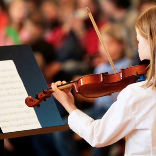 Suzuki violin students learn to play beautifully a
