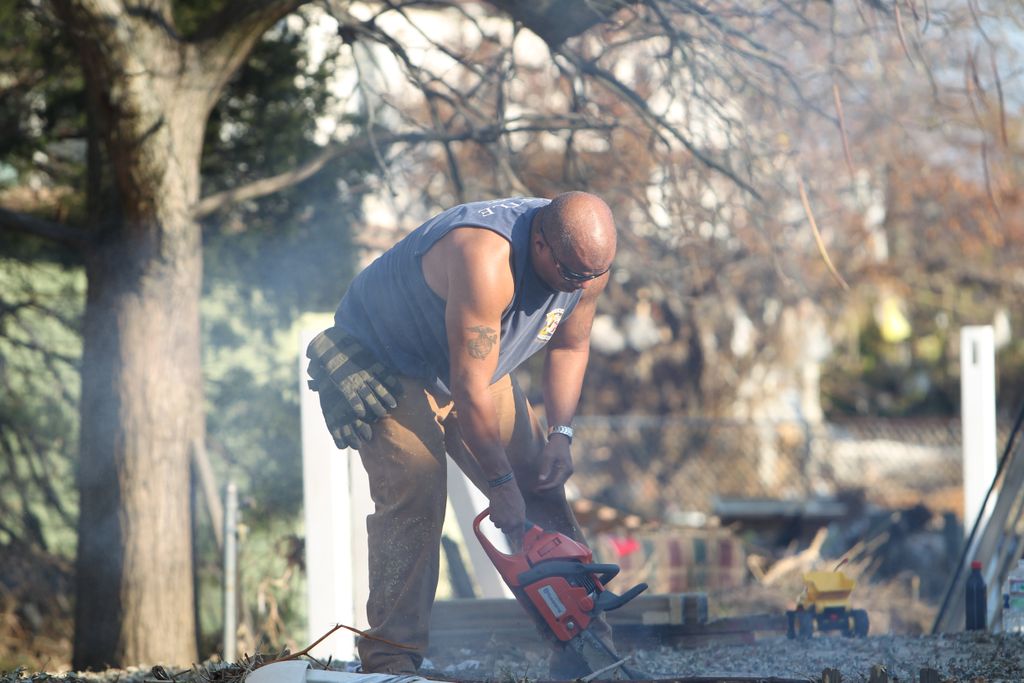 This is one of the Team Rubicon members cutting do
