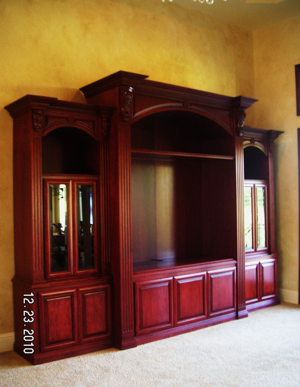 Custom stepped Cherry entertainment center feature