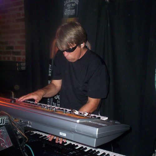 Busy at the keyboards with my band CherryBomb.