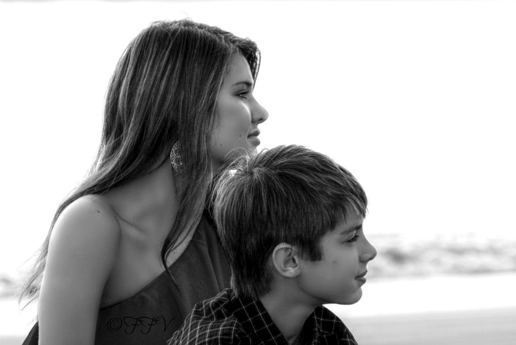family portrait of brother and sister at the beach