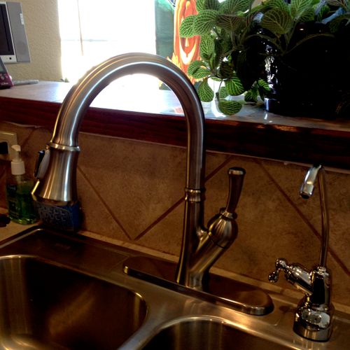 A beautiful kitchen faucet installed by our Master