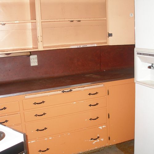 Out dated and cramped kitchen.