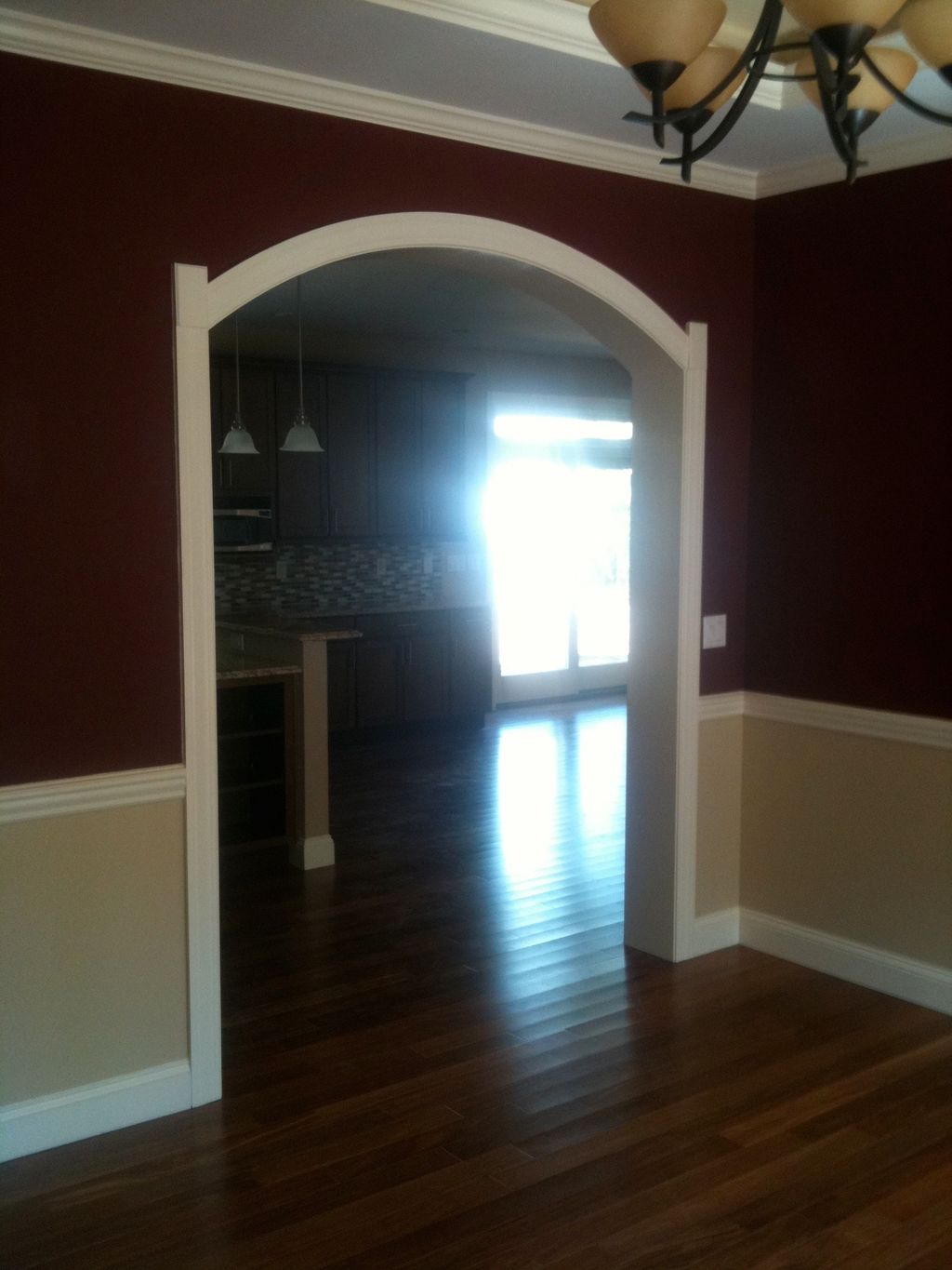 Nice custom trimmed arch with chair rail. See the 