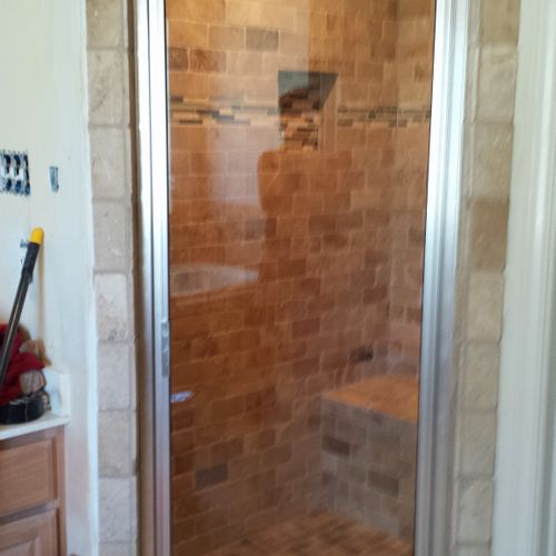 Completed shower with glass door.