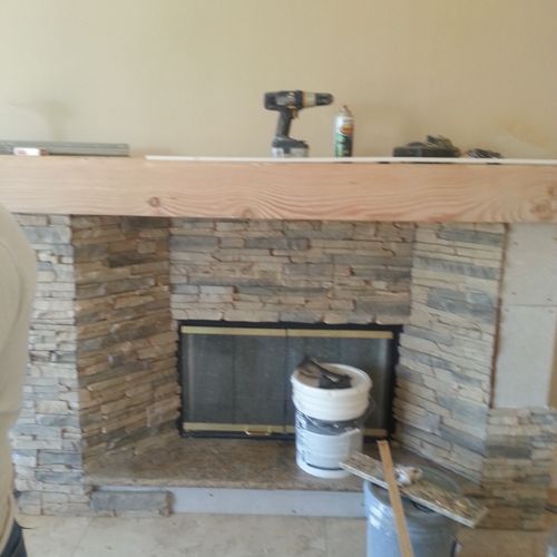 built fire place and installed veneer stone and di