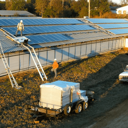 Technicians installing panels on this poultry faci